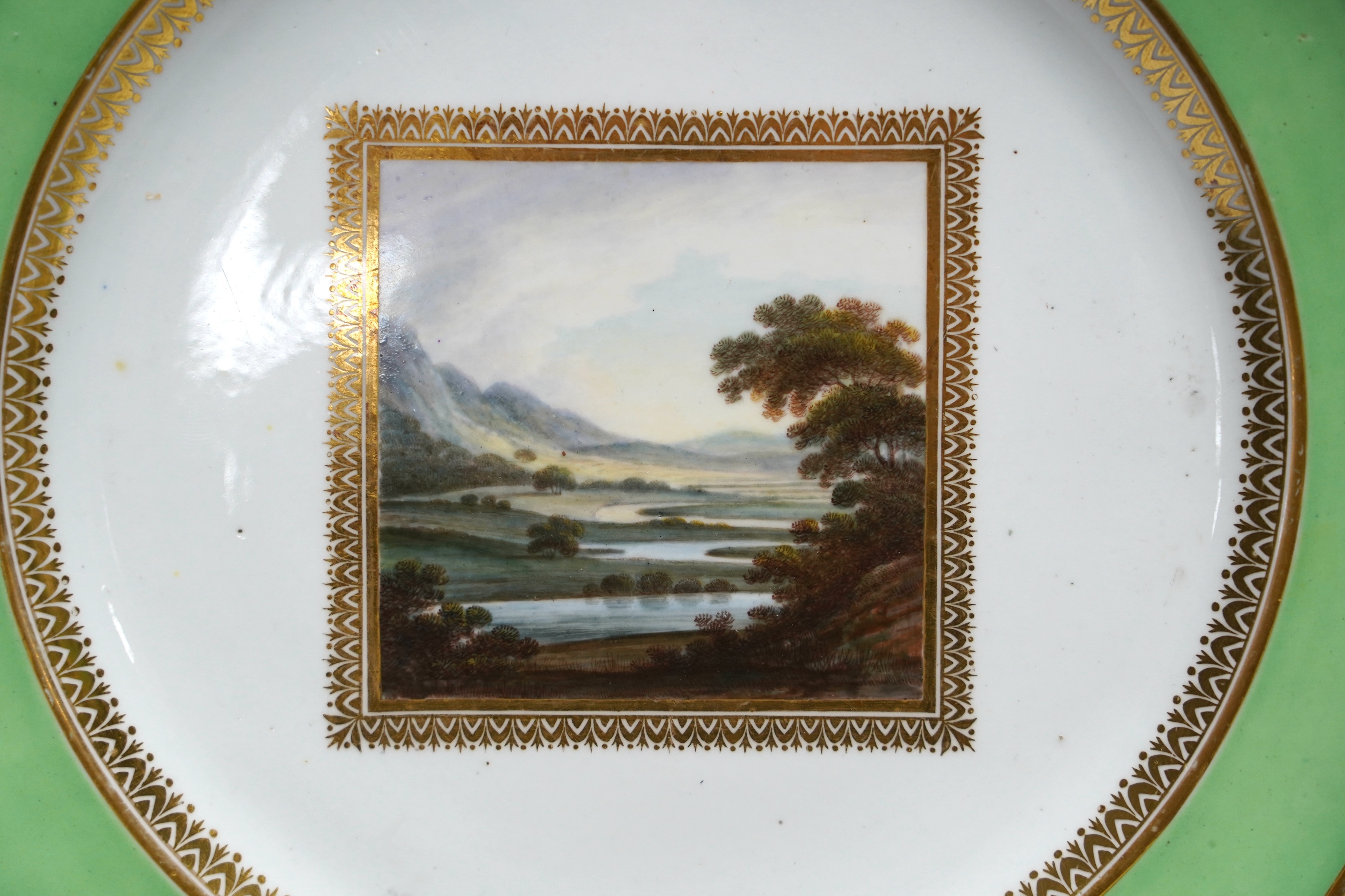Three Derby landscape plates, attributed to George Robertson, c.1795, two decorated with Scottish scenes, the other Italian scene and a Chamberlains Imari pattern plate, 25cm (4)